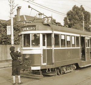 Conductress changing the trolley pole. Photograph courtesy State Library of Victoria.
